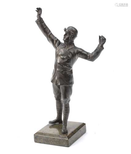 A spelter figure of an early motorist, early 20th Century,