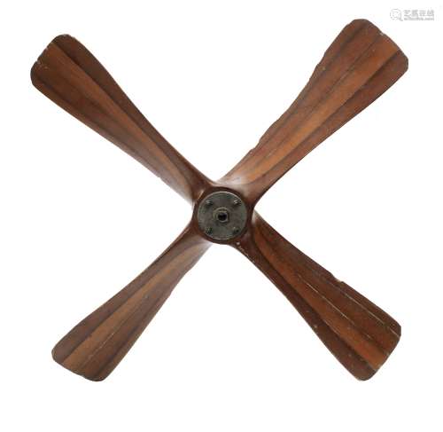 A British World War II era laminated wooden 4 bladed generator propeller, late 1930s-40s, used to...