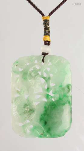 A large Chinese carved jadeite lotus & lingzhi pendant, the translucent stone with apple green