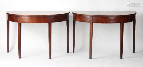 Property of a gentleman - a pair of George III mahogany demi lune tables, with square tapering legs,