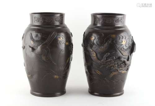 Property of a gentleman - a pair of late 19th / early 20th century Japanese bronze vases decorated