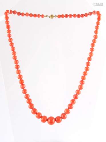 A coral bead necklace, the largest of the 70 graduated beads measuring approximately 11.5mm, with