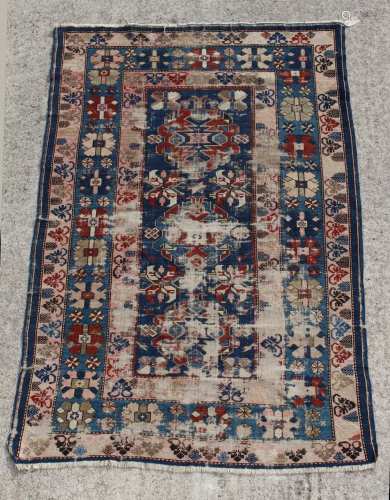Property of a lady - an antique Shirvan rug, worn, 75 by 49ins. (191 by 124cms.).