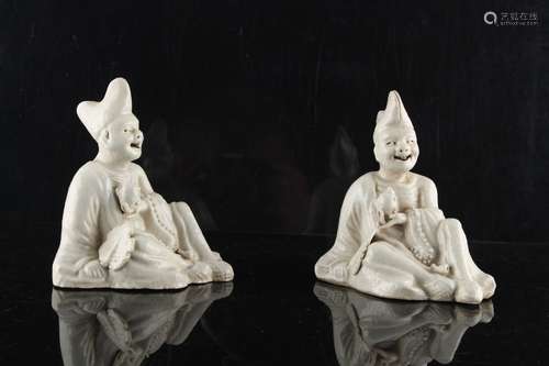 Property of a gentleman - a pair of 19th century Japanese Hirado type seated figures, with moving