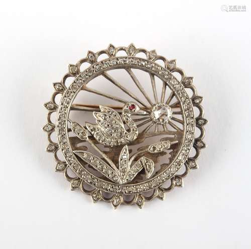 A late 19th / early 20th century unmarked gold & diamond circular brooch depicting a pond with a