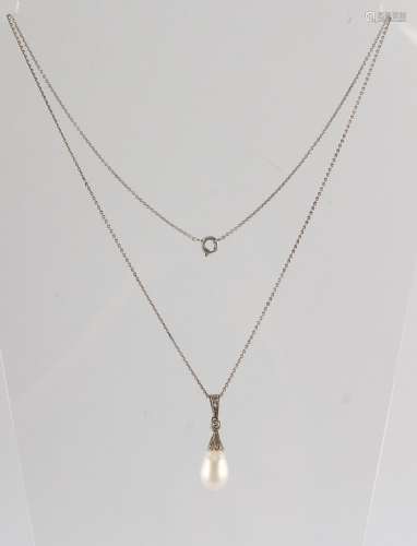 A large pearl & diamond pendant, the pear shaped pearl measuring approximately 13mm long (