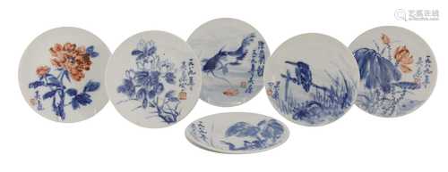 A collection of ten blue and white saucers,