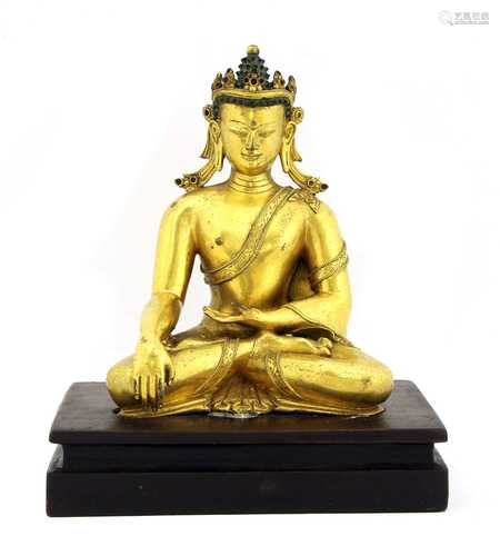 A Chinese gilt-bronze Shakyamuni Buddha,