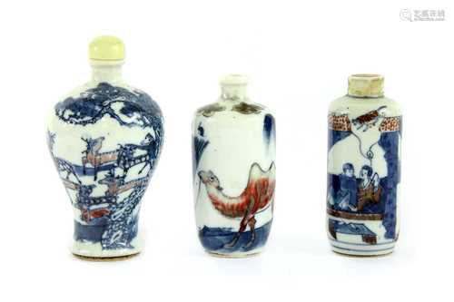 Three Chinese underglaze blue and copper-red porcelain snuff bottles