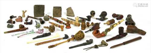 A collection of Far Eastern pipes and bowls,