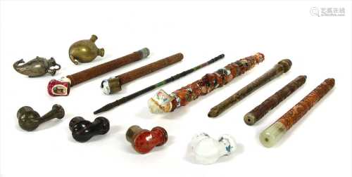 Four Persian carved wood pipes,