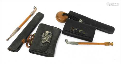 Two Japanese smoking sets, kiseruzutsu (pipecase) with kiseru and tabako-ire (tobacco pouch),