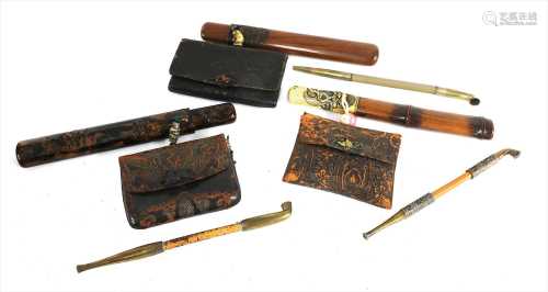 Three Japanese smoking sets, kiseruzutsu (pipecase) with kiseru and tabako-ire (tobacco pouch),
