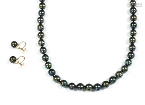 A single row uniform grey cultured pearl necklace,