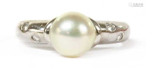 A white gold cultured pearl and diamond ring, by Mikimoto,