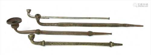 Four Tibetan steel and metal pipes,