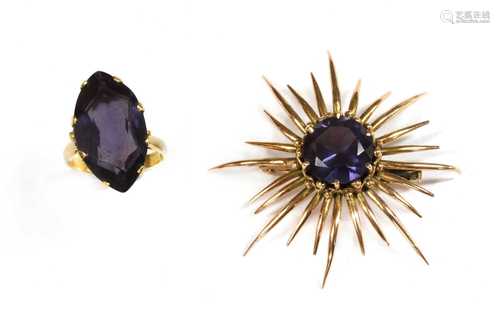 A gold synthetic colour change sapphire star burst brooch,