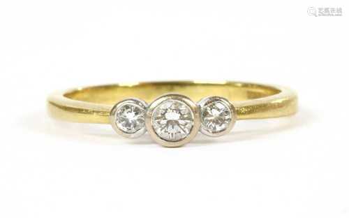 An 18ct gold three stone diamond ring,