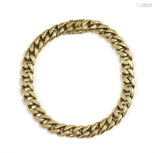 A gold curb link bracelet,