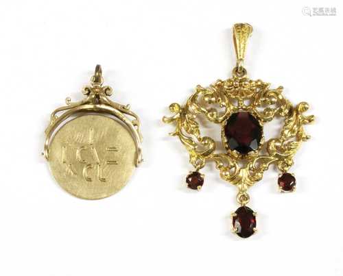 A 9ct gold garnet pendant,