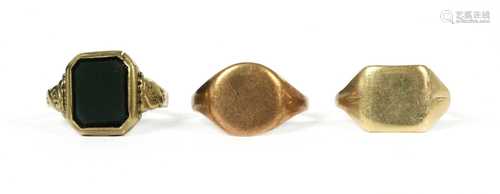 A gold signet ring,