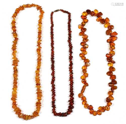 A single row tumbled clarified amber bead necklace,