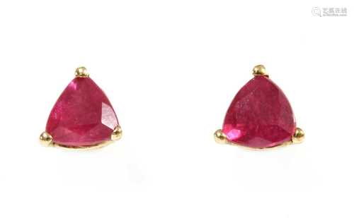 A pair of gold single stone ruby stud earrings,