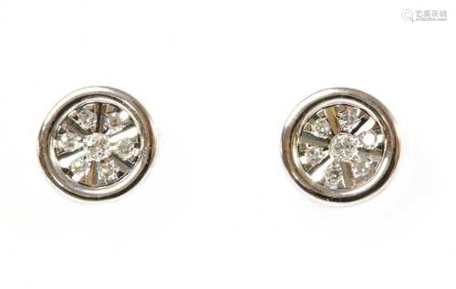 A pair of white gold diamond earrings,