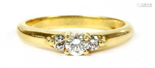 An 18ct gold three stone diamond ring,