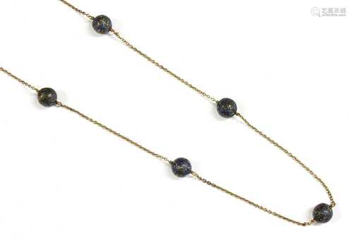 A gold enamel bead necklace,