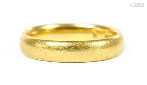 A 22ct gold court section wedding ring,