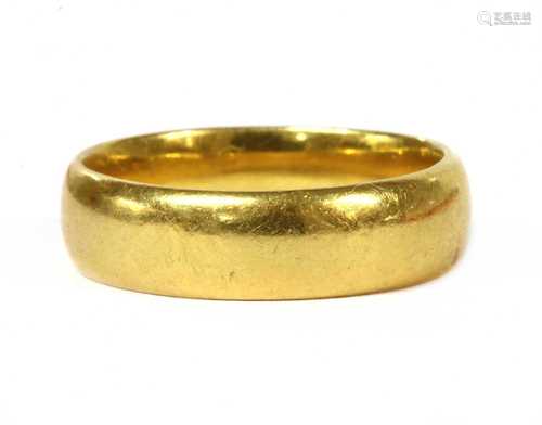 A 22ct gold light court section wedding ring,