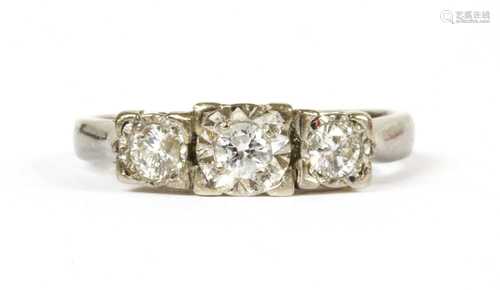 A 9ct white gold three stone diamond ring,