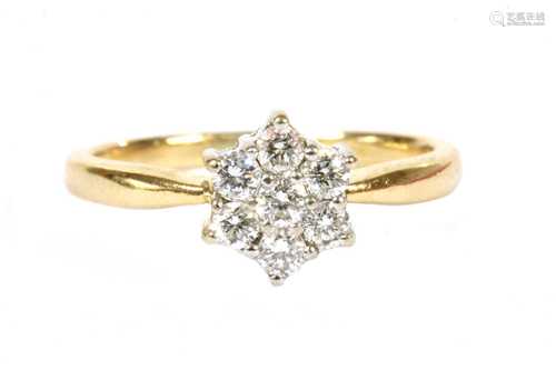 An 18ct gold diamond daisy cluster ring,