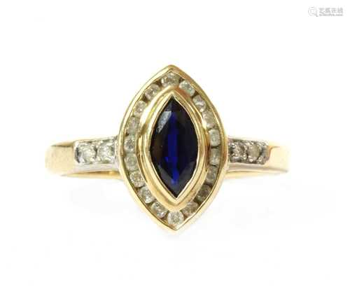 A gold sapphire and diamond cluster ring,