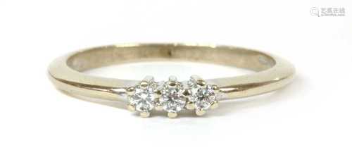 A white gold three stone diamond ring,