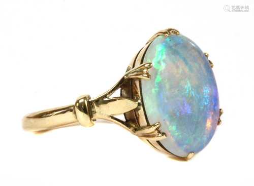 A gold single stone opal ring,