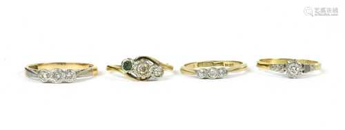 A gold three stone diamond ring,