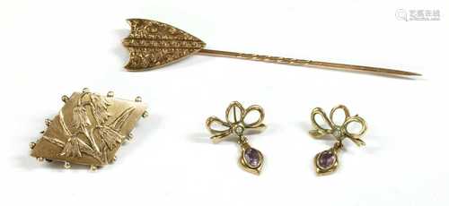 A gold shield form stick pin,