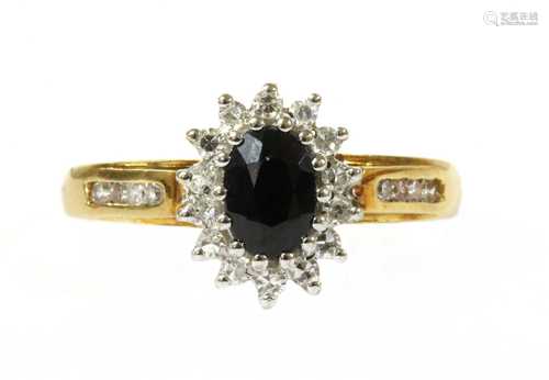 An 18ct gold sapphire and diamond cluster ring,