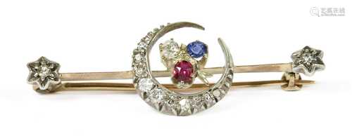 A gold and silver, diamond, ruby and sapphire crescent bar brooch,