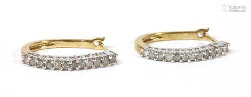 A pair of 9ct gold diamond oval hoop earrings,