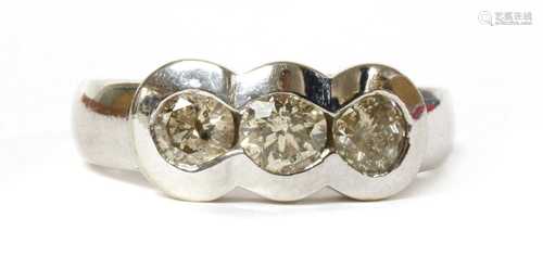 A white gold three stone diamond ring,