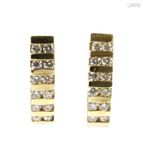 A pair of gold diamond half hoop earrings,