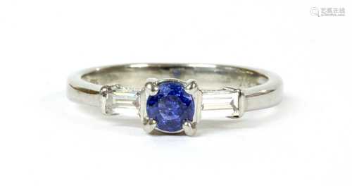 An 18ct white gold sapphire and diamond three stone ring,