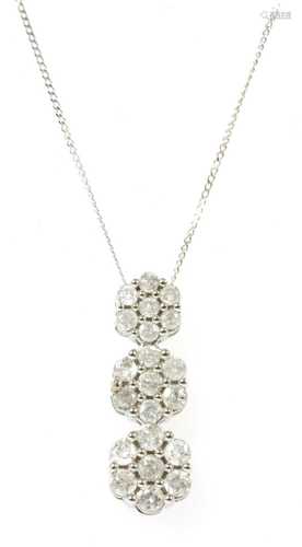 A white gold diamond cluster pendant,