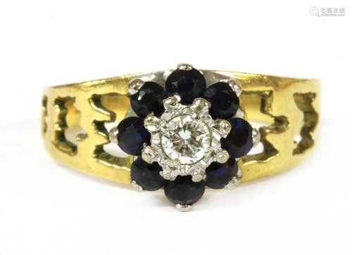 A gold diamond and sapphire cluster ring,