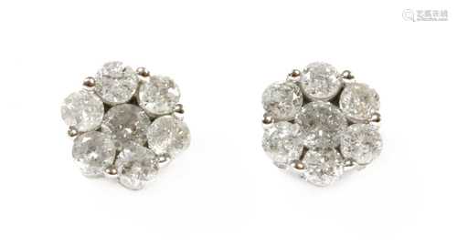 A pair of white gold diamond daisy cluster earrings,