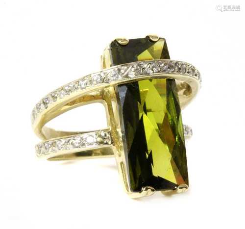 A gold green tourmaline and cubic zirconia ring,