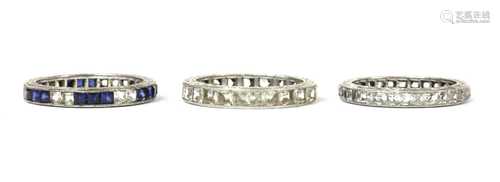 Three silver paste set full eternity rings,